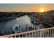 Beautiful waterfront view from the home at sunset with boats docked along the channel at 11721 1St E St, Treasure Island, FL 33706