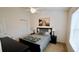 Comfortable bedroom with a ceiling fan, a large window, and neutral décor at 1552 Blue Magnolia Rd, Brandon, FL 33510