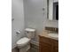 Updated bathroom with granite countertop and white toilet at 401 Dorchester Pl # 62, Sun City Center, FL 33573