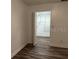 Bedroom with wood laminate flooring, neutral paint and closet at 401 Dorchester Pl # 62, Sun City Center, FL 33573