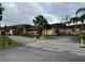 Exterior view of the building with crosswalk and plants around at 401 Dorchester Pl # 62, Sun City Center, FL 33573