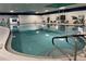 Bright indoor pool area with accessible entry and exit features, and plenty of lounge seating at 401 Dorchester Pl # 62, Sun City Center, FL 33573