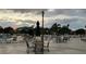 View of a patio with seating and umbrellas at 401 Dorchester Pl # 62, Sun City Center, FL 33573