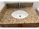 Bathroom vanity with granite countertop and an oval sink at 401 Dorchester Pl # 62, Sun City Center, FL 33573