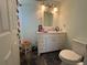 Well-lit bathroom featuring a modern vanity, stylish fixtures and decorative accents at 5730 16Th Ne Ln, St Petersburg, FL 33703