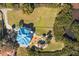 Aerial view showcasing this beautiful home with pool, spa, and lush landscaping at 6785 Burning Tree Dr, Seminole, FL 33777