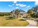 Beautiful property with lush lawn, long driveway, and a picturesque home with inviting architecture at 6785 Burning Tree Dr, Seminole, FL 33777