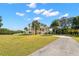 Expansive property showcasing lush lawn, driveway, and a beautiful home with inviting architecture at 6785 Burning Tree Dr, Seminole, FL 33777