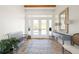 Welcoming foyer with white and blue decor, neutral tile floor, and bright natural light at 6785 Burning Tree Dr, Seminole, FL 33777