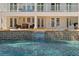 Relaxing pool with mosaic tile and comfortable seating, perfect for outdoor entertaining at 6785 Burning Tree Dr, Seminole, FL 33777