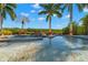 Inviting pool area with a rock waterfall, perfect for relaxation and recreation at 6785 Burning Tree Dr, Seminole, FL 33777