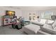 Spacious rec room offering a relaxed seating area and access to the backyard at 6785 Burning Tree Dr, Seminole, FL 33777