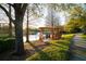 Scenic outdoor seating area featuring a pergola swing set and a lake view at 10217 Westpark Preserve Blvd, Tampa, FL 33625