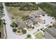 An aerial shot of a home in a tranquil neighborhood with lush greenery and well-maintained surroundings at 18311 Arbor Crest Dr, Hudson, FL 34667