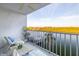 Relaxing balcony view with cozy seating and waterfront scenery at 18325 Gulf Blvd # 405, Redington Shores, FL 33708
