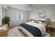 Cozy bedroom with neutral decor, and lots of light from a big window at 18325 Gulf Blvd # 405, Redington Shores, FL 33708