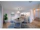Charming dining area with round table, seating for four, and an open view to the kitchen at 18325 Gulf Blvd # 405, Redington Shores, FL 33708