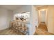 Open view from dining area into kitchen with breakfast bar and plenty of light at 18325 Gulf Blvd # 405, Redington Shores, FL 33708
