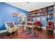 Home office features stylish furniture, hardwood floors, and a built-in bookcase at 319 26Th W St, Bradenton, FL 34205