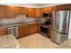 Well-equipped kitchen featuring stainless steel appliances and granite countertops at 3602 Cambridge W Dr, Bradenton, FL 34205