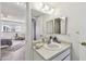Bathroom with a vanity, mirror, and partial view into the bedroom at 4732 Lake Blvd # A, Clearwater, FL 33762