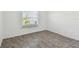Minimalist bedroom featuring tiled flooring and a window that welcomes natural light at 4732 Lake Blvd # A, Clearwater, FL 33762