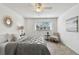 Well-lit bedroom with a comfortable bed, tile flooring, and a window view at 4732 Lake Blvd # A, Clearwater, FL 33762