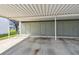 Carport area with concrete flooring and storage units, providing convenient covered parking at 4732 Lake Blvd # A, Clearwater, FL 33762