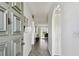 Bright hallway with tile flooring leading to a living area, shows an open floor plan at 4732 Lake Blvd # A, Clearwater, FL 33762