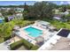 Inviting community pool area featuring tiki huts, lounge chairs, and a refreshing swimming space at 4732 Lake Blvd # A, Clearwater, FL 33762