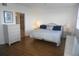 Comfortable bedroom with wood floors and access to the bathroom and walk-in closet at 6315 Shoreline Dr # 3208, St Petersburg, FL 33708