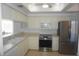 Well-maintained kitchen with stainless steel appliances and ample cabinet space at 6315 Shoreline Dr # 3208, St Petersburg, FL 33708