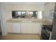 Kitchen with stone countertops, appliances, and a pass-through to living area at 6315 Shoreline Dr # 3208, St Petersburg, FL 33708
