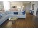 Bright living room with comfortable seating, hardwood flooring, and natural light at 6315 Shoreline Dr # 3208, St Petersburg, FL 33708