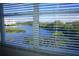 Window view of the beautiful outdoor scenery with lake, trees, and sky at 6315 Shoreline Dr # 3208, St Petersburg, FL 33708