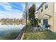 Townhome backyard featuring a barbecue, patio, and stunning water views at 9111 Moonlit Meadows Loop, Riverview, FL 33578