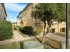 Exterior shot of a charming townhome and landscaped yard at 9111 Moonlit Meadows Loop, Riverview, FL 33578