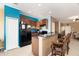 Well-lit kitchen featuring tiled floors and modern appliances at 9111 Moonlit Meadows Loop, Riverview, FL 33578