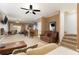 Open-concept living area with bar seating and access to kitchen and backyard at 9111 Moonlit Meadows Loop, Riverview, FL 33578