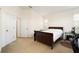 Bright main bedroom with neutral decor and ample closet space at 9111 Moonlit Meadows Loop, Riverview, FL 33578