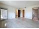 Bright bedroom with doors to a closet, bathroom, and sunroom at 9888 Lake Seminole E Dr, Largo, FL 33773