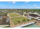 Aerial view of lawn bowling, a rec center and a golf course for an active lifestyle at this community at 1311 Caloosa Lake Ct, Sun City Center, FL 33573