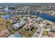 Gorgeous aerial view of a lakeside community with lush greenery at 1311 Caloosa Lake Ct, Sun City Center, FL 33573
