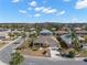 Beautiful aerial view of home, neighborhood, and manicured landscaping at 1311 Caloosa Lake Ct, Sun City Center, FL 33573