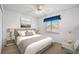 Comfortable bedroom featuring soft lighting, neutral tones and a window with a view of the outside at 1311 Caloosa Lake Ct, Sun City Center, FL 33573