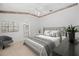 Comfortable bedroom with a plush bed, soft lighting, and neutral decor providing a relaxing atmosphere at 1311 Caloosa Lake Ct, Sun City Center, FL 33573