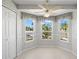 Cozy dining area with bay windows and views of the outdoors at 1311 Caloosa Lake Ct, Sun City Center, FL 33573