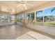 Spacious sunroom features tiled floors and abundant natural light with views of the backyard and patio at 1311 Caloosa Lake Ct, Sun City Center, FL 33573