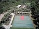 Aerial view of the basketball court within the community with well-manicured landscaping and a garden in the background at 15856 Cobble Mill Dr, Wimauma, FL 33598