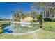 Elegant community entrance sign featuring the Valencia Lakes name amidst lush landscaping and a water feature at 15856 Cobble Mill Dr, Wimauma, FL 33598